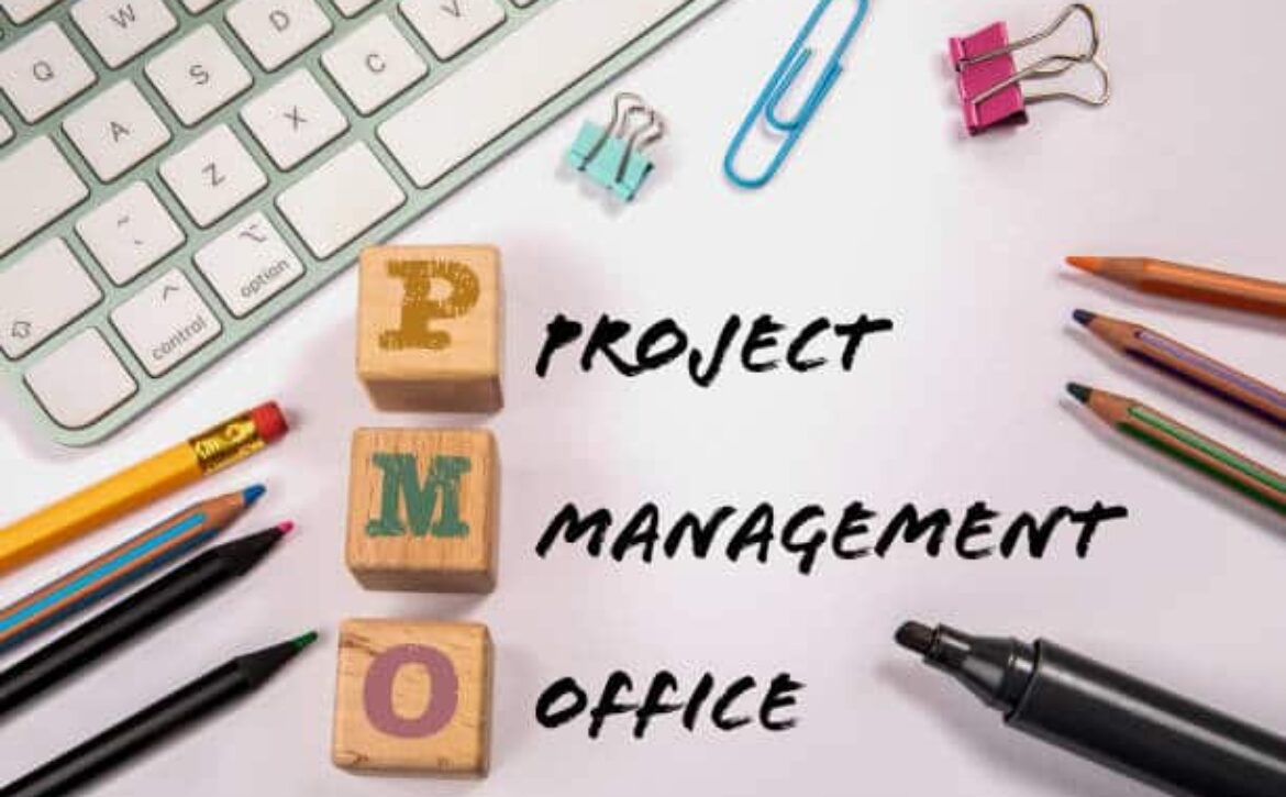 PMO - Project Management Office. Office supplies on the table.
