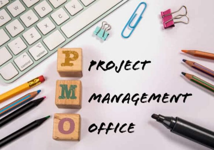 PMO - Project Management Office. Office supplies on the table.